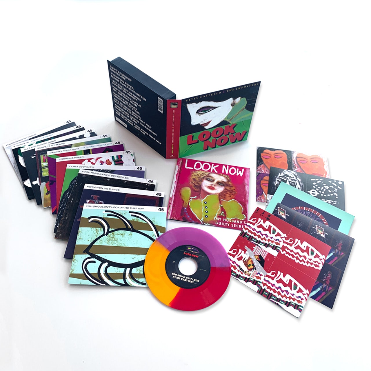 ELVIS COSTELLO & THE IMPOSTERS 'LOOK NOW' DELUXE BOX SET (8 Tri-Color 7" Vinyl)